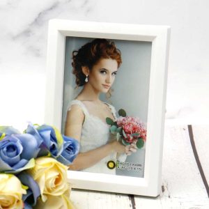 قاب عکس شیب دار سفید 10*15 سانتی متر_69335e9aa7554.jpeg قاب عکس شیب دار سفید 10*15 سانتی متر